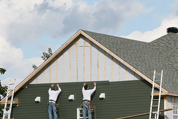 Professional Siding technician working in Evans, CO